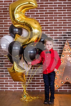 Beautiful kids, little boys celebrating birthday and blowing candles on homemade baked cake, indoor. Birthday party for