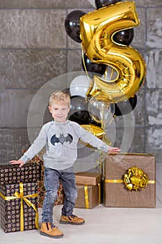 Beautiful kids, little boys celebrating birthday and blowing candles on homemade baked cake, indoor. Birthday party for