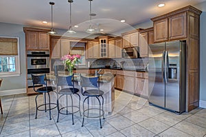 Beautiful kitchen with island and stainless steel appliances