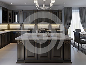 Beautiful kitchen in luxury home with island, pendant lights, cabinets, and self-leveling floors. marble backsplash, elegant