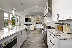 Beautiful kitchen in luxury home modern interior with island and stainless steel chairs