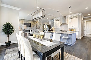 Beautiful kitchen in luxury modern contemporary home interior with island and chairs