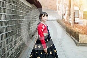 Beautiful Korean girl in Hanbok at Gyeongbokgung, the traditional Korean dress