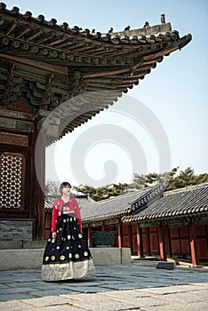 Beautiful Korean girl in Hanbok at Gyeongbokgung, the traditional Korean dress