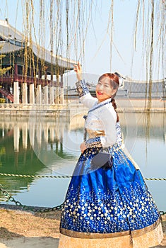 Beautiful Korean woman dressed Hanbok, Korean traditional dress, in Gyeongbokgung Palace