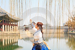 Beautiful Korean woman dressed Hanbok, Korean traditional dress, in Gyeongbokgung Palace