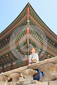Beautiful Korean woman dressed Hanbok, Korean traditional dress, in Gyeongbokgung Palace