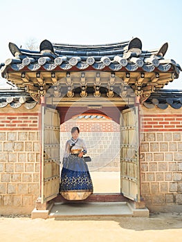 Beautiful Korean woman dressed Hanbok, Korean traditional dress, in Gyeongbokgung Palace