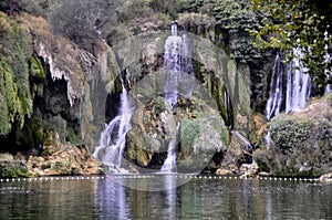 Beautiful Kravica waterfall in Bosnia and Herzegovina - popular swimming and picnic area for tourists