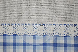 Beautiful lace and blue tartan textile texture background