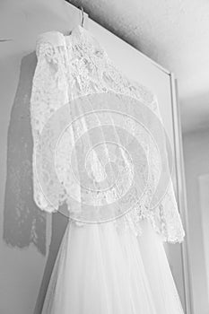 Beautiful lace bridal dress awaiting the bride