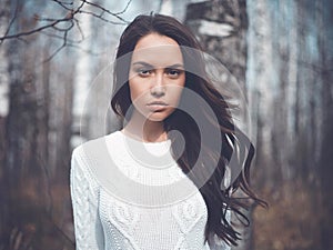 Beautiful lady in a birch forest