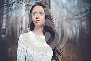 Beautiful lady in a birch forest