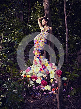 Beautiful lady in dress of flowers