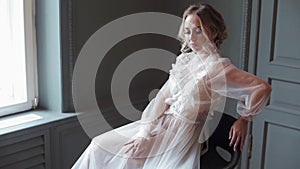 Beautiful lady in elegant white robe