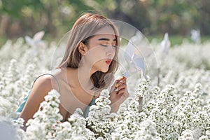 Beautiful lady in a flower garden.