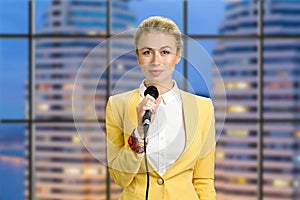 Beautiful lady holding microphone. photo