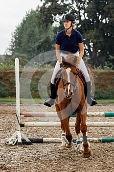 Beautiful lady jumping with her stud horse
