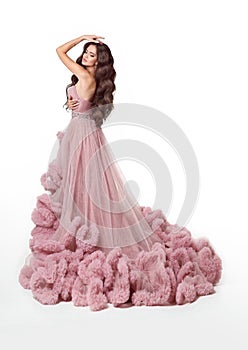 Beautiful Lady in luxury lush pink dress. Fashion brunette woman