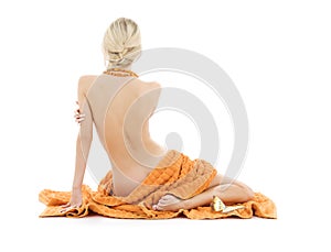 Beautiful lady with orange towels