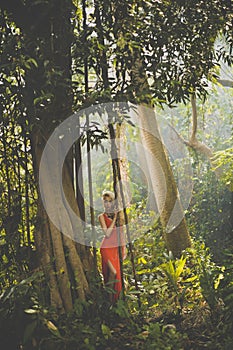 Beautiful lady in tropical forest