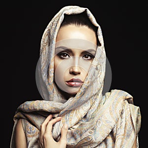 Beautiful lady wrapped in a orient shawl photo