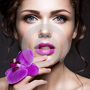 Beautiful lady with a wreath of flowers photo