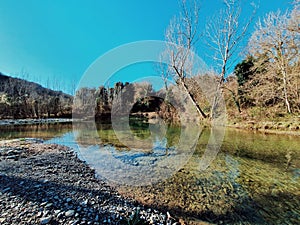 A beautiful lake of Cerqueto, stone lake and clear water in the winter, natural visite in Perousse, Italy photo