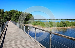 Beautiful lake in maas dunes national park, wood bridge of circular hiking trail - Reindersmeer, Netherlands