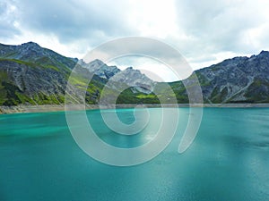 Beautiful lake in the mountains blue water cloudy sky