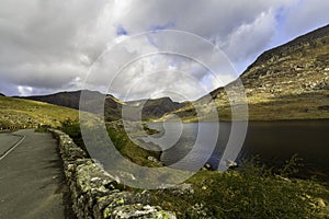 Beautiful lake and Mountains Sun and cloud. Ogwen Cottage, Snowdonia, Wales, wideangle A5 road in foreground