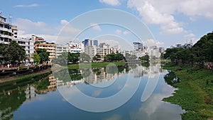 Beautiful lake and the reflection of urbanisation photo
