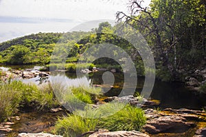 Beautiful lake in sunny day formed by waterfalls - Serra da Canastra National Park - Minas Gerais, Brazil