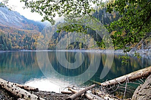 Beautiful lake surrounded by mountains and forests in autumn. Malaya Ritsa, Abkhazia