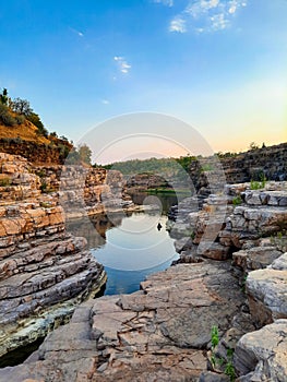 A beautiful lake surrounded by rocky mountain at Chidiya Bhadak, Indore, Madhya Pradesh, India