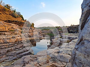 A beautiful lake surrounded by rocky mountain at Chidiya Bhadak, Indore, Madhya Pradesh, India