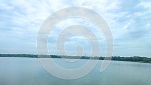 Beautiful lake view. Blue sky with flying bird.Cloud reflection on the water