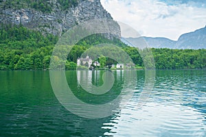 A Beautiful Lakeside View with Stunning Mountain Scenery and Historic Buildings.