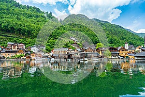 A Beautiful Lakeside View with Stunning Mountain Scenery and Historic Buildings.