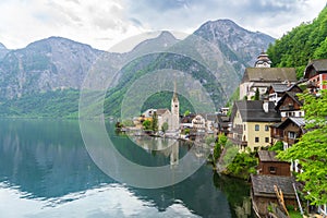 A Beautiful Lakeside View with Stunning Mountain Scenery and Historic Buildings.