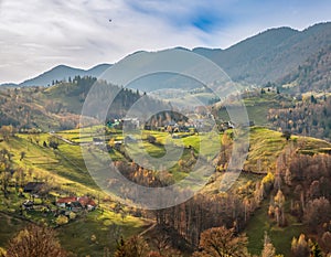 Beautiful landscape aerial view with Carpathian Mountains in Brasov county Romania captured in autumn