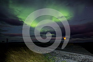 Beautiful landscape with Aurora borealis taken in Iceland on a clear sky night