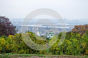 Beautiful landscape of the autumn city of Kiev. View of the river and church