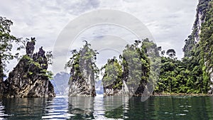 Beautiful landscape with background mountains trees and mist and a river sky and natural attractions in front at dam Thailand