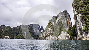 Beautiful landscape with background mountains trees and mist and a river sky and natural attractions in front at dam Thailand.