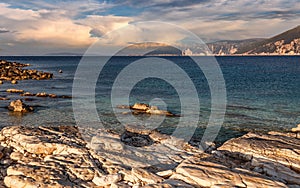 Beautiful landscape with bay. Sunny spring seascape of Ionian Sea with colorful sky during sunset. Wonderful summer day