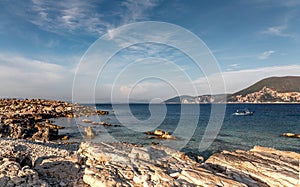 Beautiful landscape with bay. Sunny spring seascape of Ionian Sea with colorful sky during sunset. Wonderful summer day on the