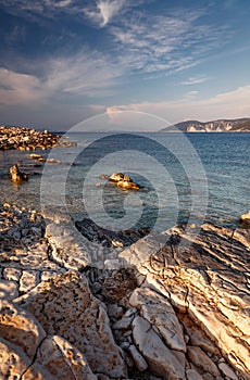 Beautiful landscape with bay. Sunny spring seascape of Ionian Sea with colorful sky during sunset. Wonderful summer day