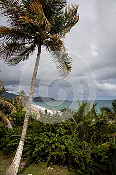 Beautiful landscape of a beach in Maunabo, Puerto Rico against a cloudy blue sky