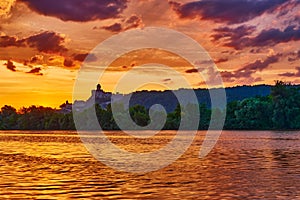 Beautiful Landscape with castle and river at summer sunrise, Trencin, Slovakia.